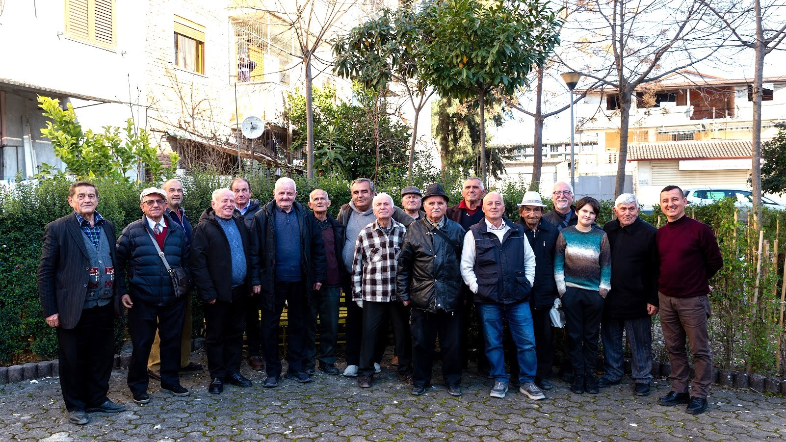 Elderly men grouped together