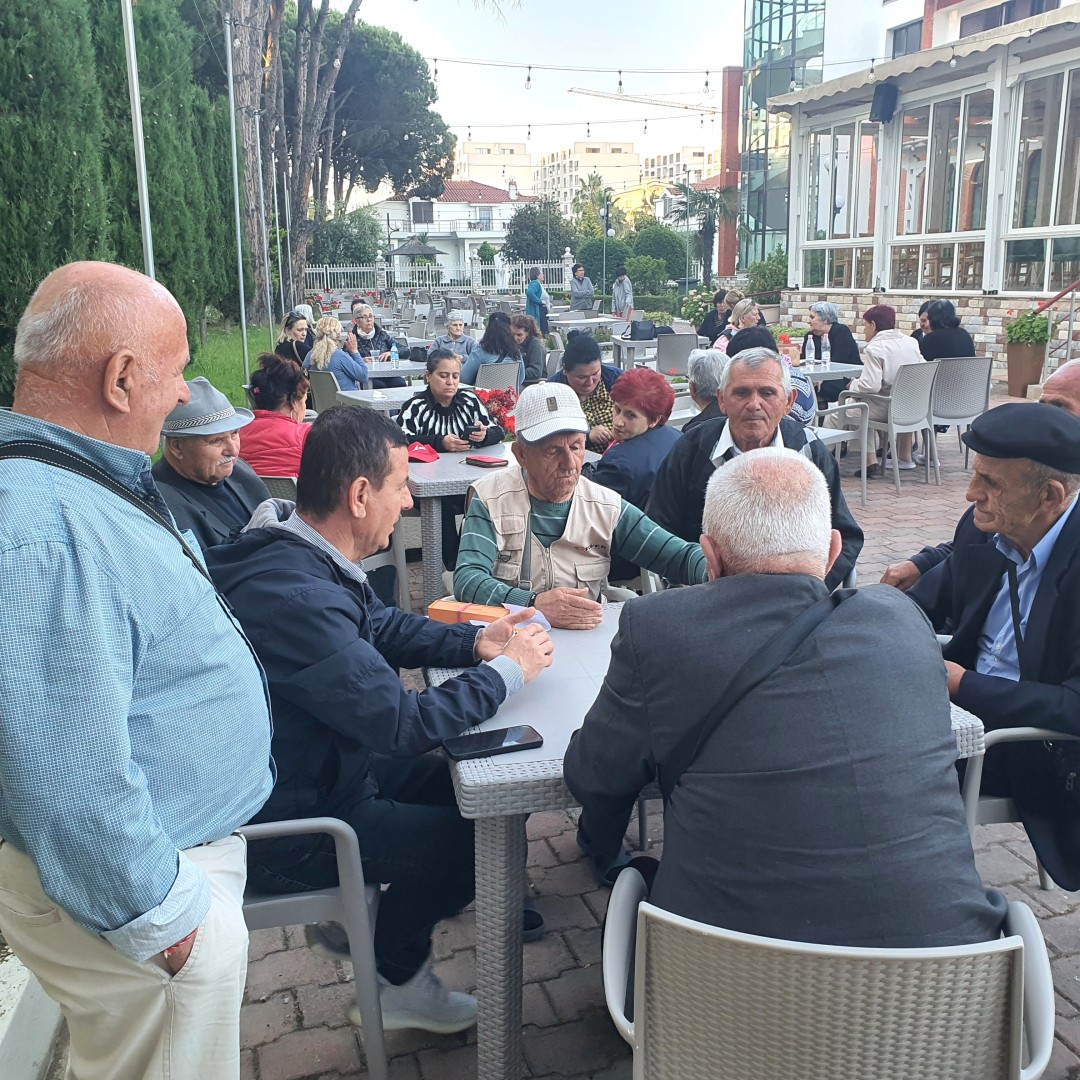 men playing table games outside