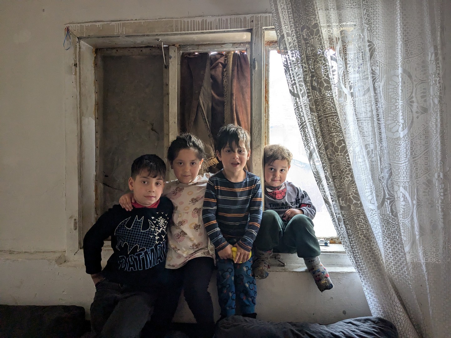 The family's home isn;t well insulated for winter and has several broken windows which let the cold in.